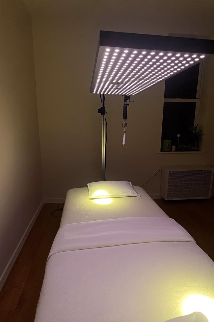 The LED light panel over a treatment bed